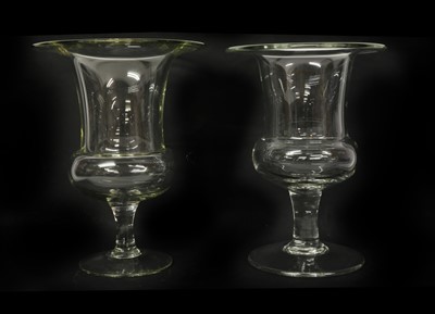 Lot 104 - A set of three glass urns
