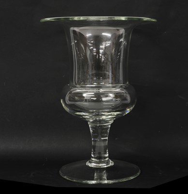 Lot 104 - A set of three glass urns