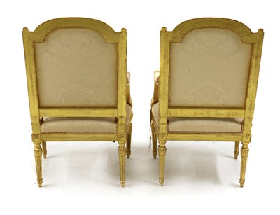 Lot 353 - A pair of Louis XVI style giltwood armchairs