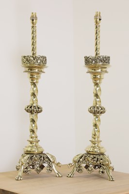 Lot 795 - A pair of impressive brass altar stick lamps