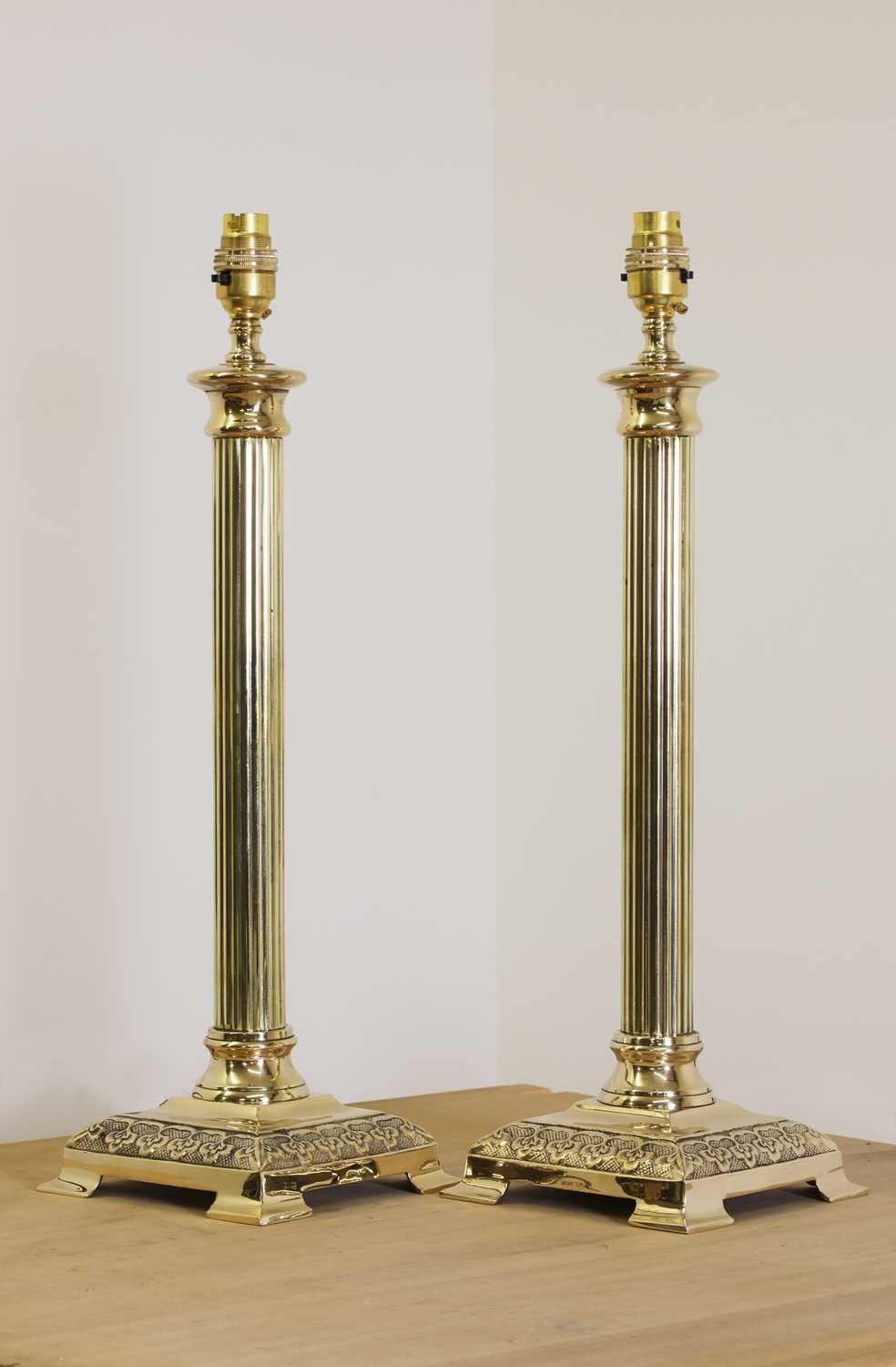 Lot 258 - A pair of brass candlestick lamps