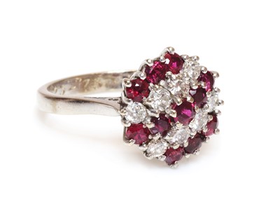 Lot 104 - A ruby and diamond hexagonal cluster ring, c.1970