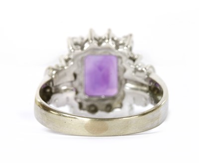 Lot 1247 - An American white gold, amethyst and diamond rectangular cluster ring
