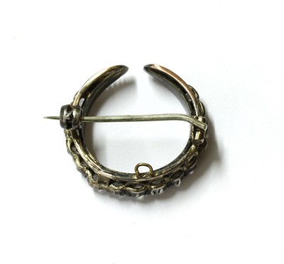 Lot 7 - A silver and gold, diamond crescent brooch