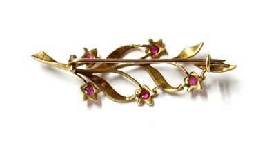 Lot 41 - A gold ruby and split pearl spray brooch
