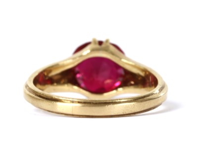 Lot 215 - A gold single stone synthetic ruby ring