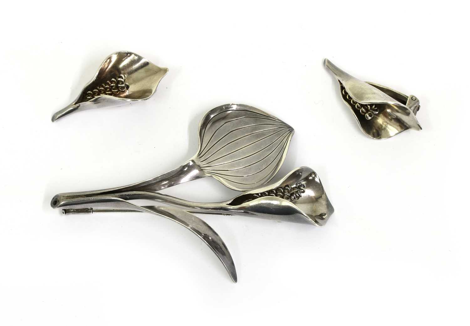 Lot 71 - A Danish silver calla lily brooch and earrings suite, by Anton Michelsen