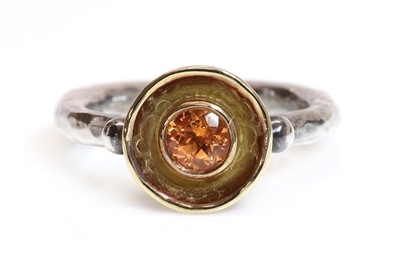 Lot 416 - A silver and gold mandarin garnet ring, by Malcolm Morris
