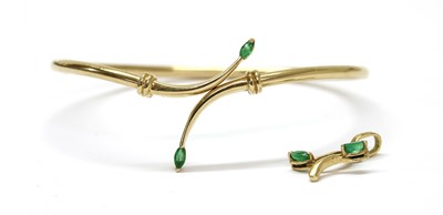 Lot 272 - A gold emerald bangle