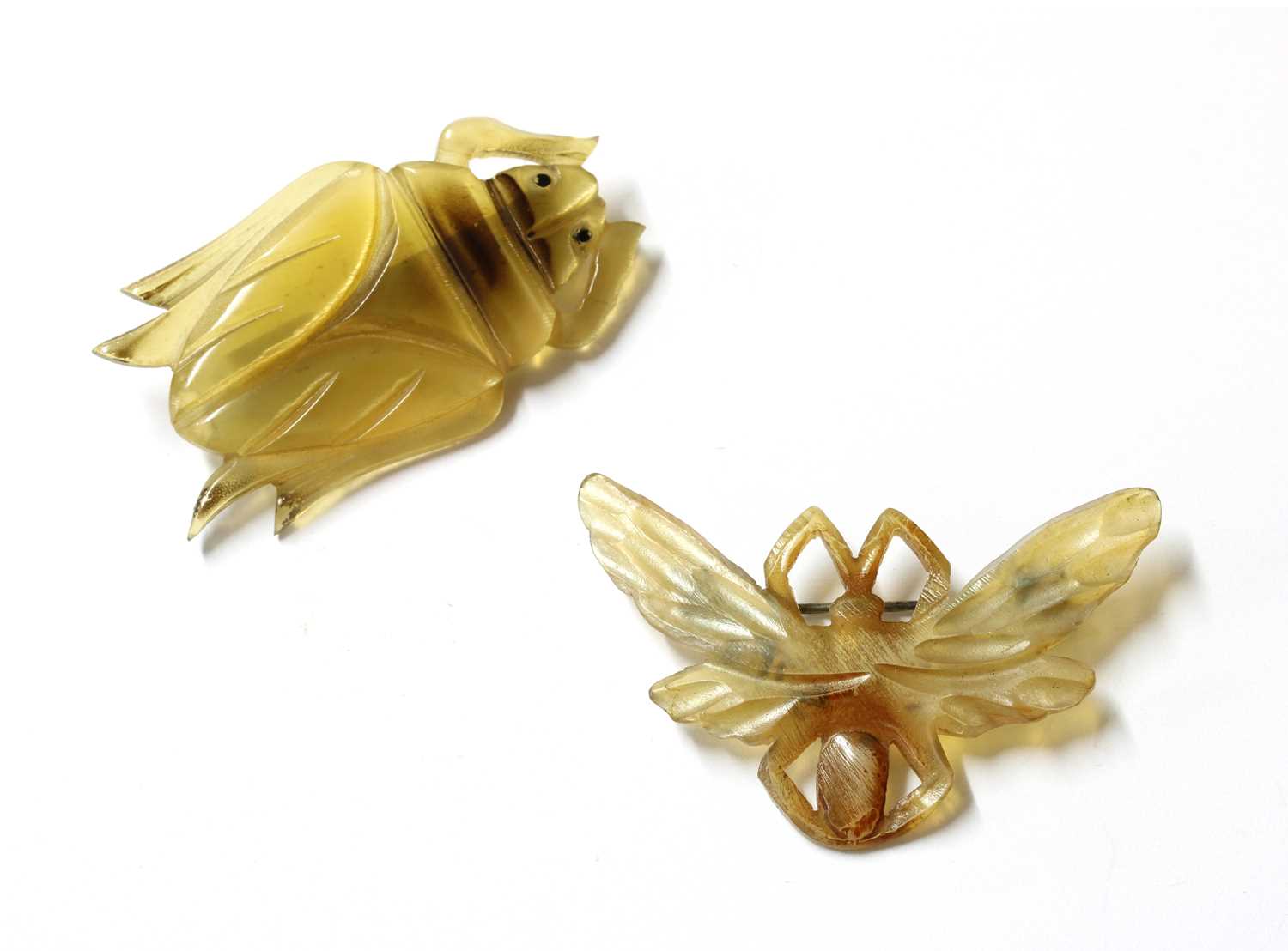 Lot 49 - Two French Art Nouveau carved horn brooches