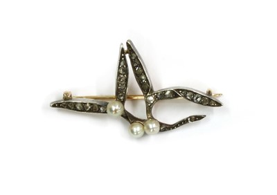 Lot 1009 - A Victorian silver and gold, pearl and diamond mistletoe brooch