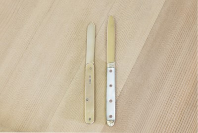 Lot 679 - Two gold folding fruit knives