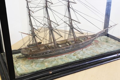 Lot 11 - A cased model ship