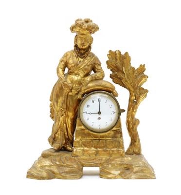 Lot 135 - An 18th century carved pine and gilt figural mantel clock