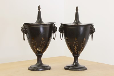 Lot 697 - A pair of Regency-style toleware chestnut urns and covers