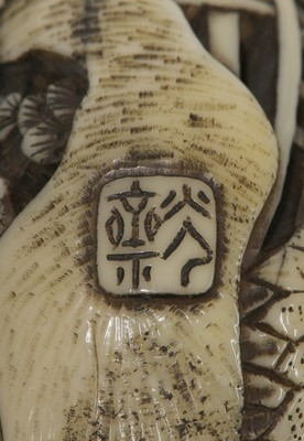 Lot 256 - A Japanese ivory manju netsuke