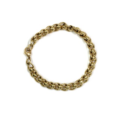 Lot 1230 - A 9ct gold curb and roller link bracelet