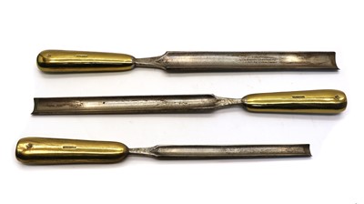 Lot 152 - A graduated set of three brass and steel shipwright's gouges
