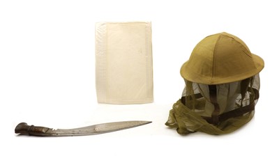 Lot 18 - A WWII Burma campaign steel helmet