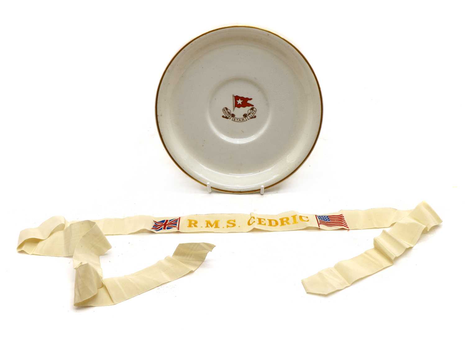 Lot 21 - R M S Cedric, a White Star Line plate and Sailor's Cap Tally for R M S Cedric