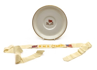 Lot 21 - R M S Cedric, a White Star Line plate and Sailor's Cap Tally for R M S Cedric