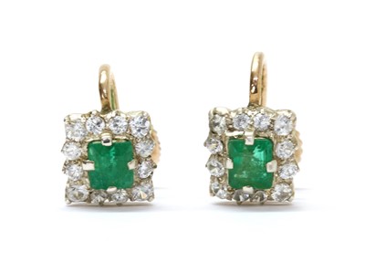 Lot 277 - A pair of silver and gold emerald and white sapphire cluster earrings