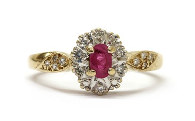 Lot 219 - A 9ct gold ruby and diamond cluster ring