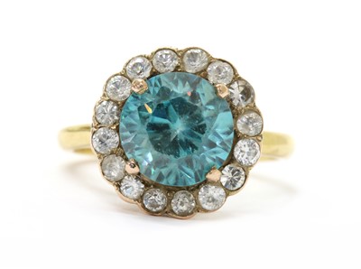 Lot 304 - A gold blue zircon and white sapphire cluster ring