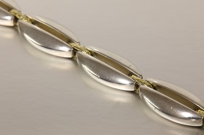 Lot 415 - A sterling silver and gold bracelet, by Georg Jensen