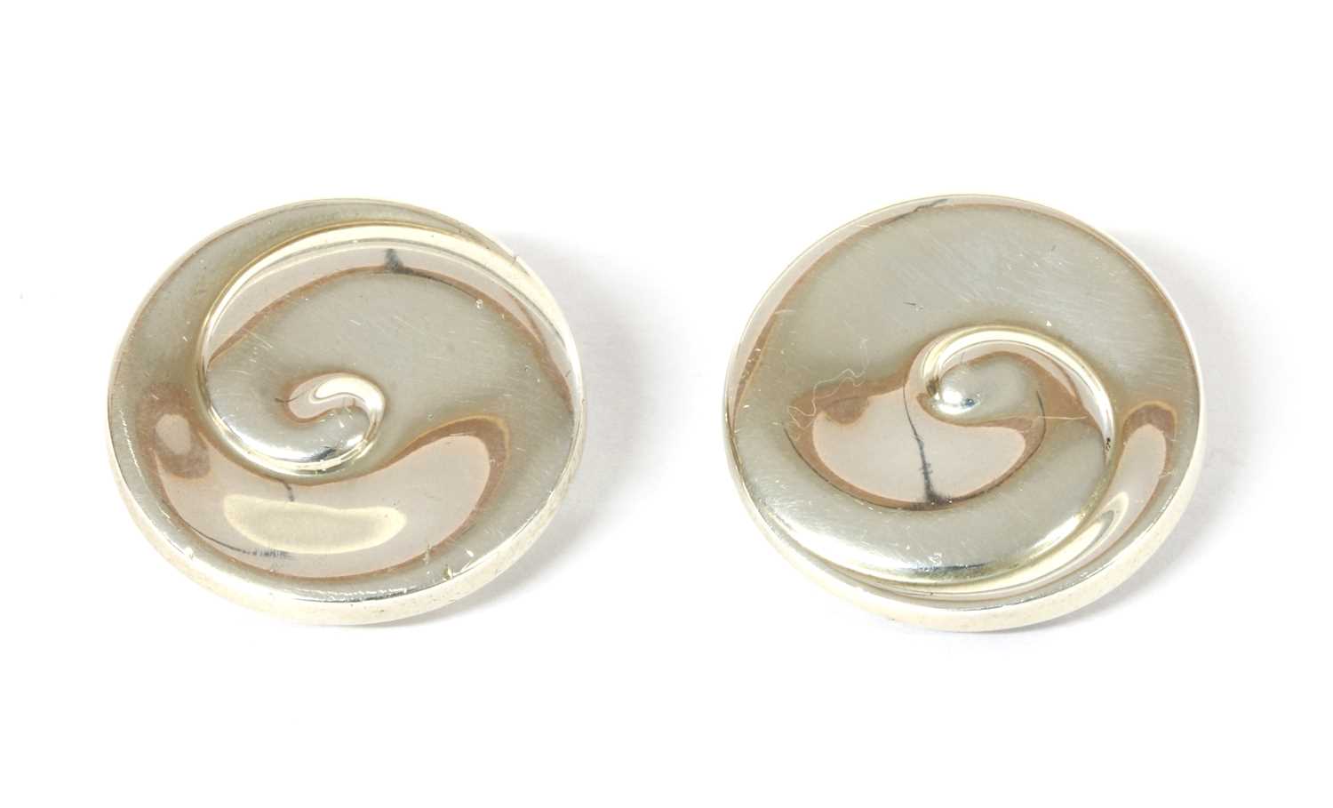Lot 1084 - A pair of sterling silver Georg Jensen swirl earrings