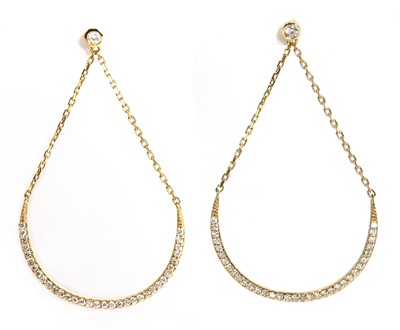 Lot 491 - A pair of diamond set 'smile' drop earrings