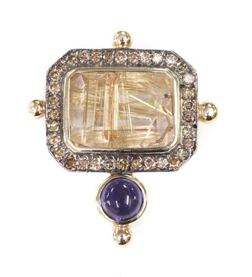 Lot 401 - A gold rutilated quartz, iolite and diamond brooch