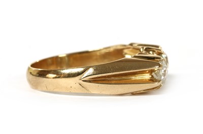 Lot 1007 - A gold three stone diamond ring