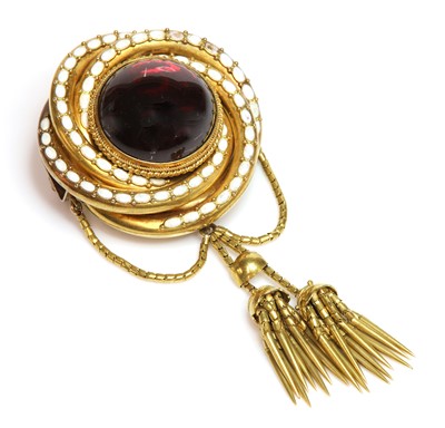 Lot 56 - A Victorian gold garnet and enamel brooch
