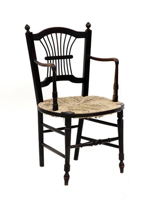 Lot 200 - A Morris & Co. ebonised 'Sussex' elbow chair