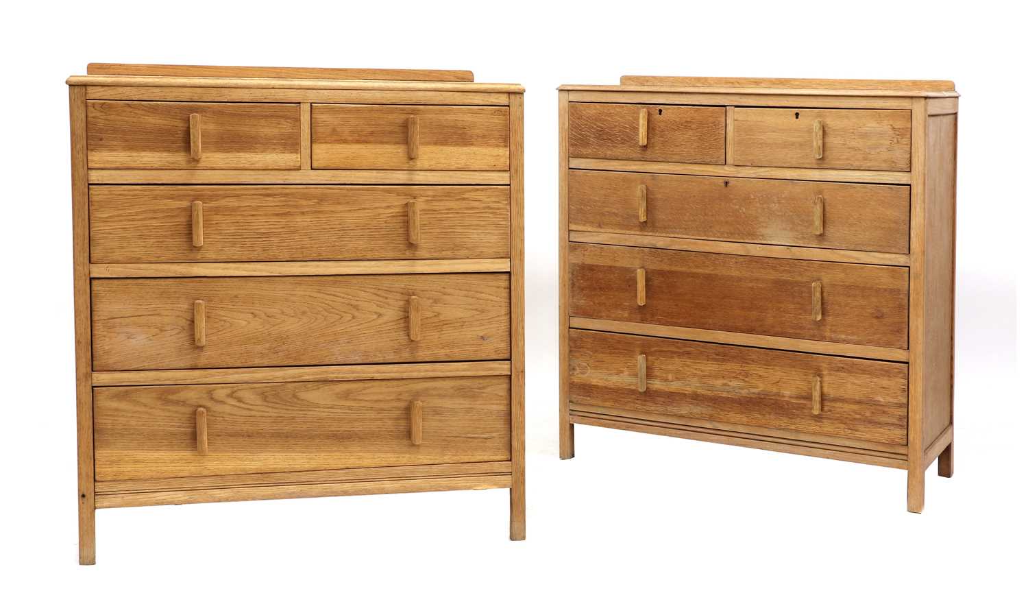 Lot 214 - A near pair of Cotswold School limed oak chests
