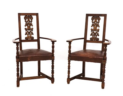 Lot 145 - A pair of Arts and Crafts oak armchairs