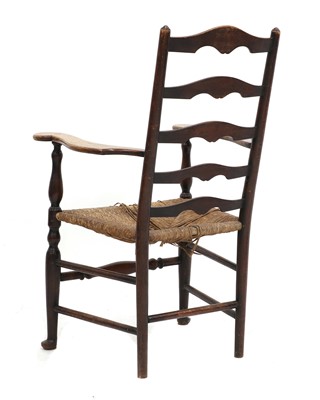Lot 165 - A Lutyens-style oak ladderback armchair