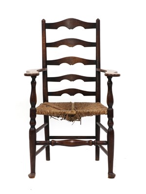 Lot 165 - A Lutyens-style oak ladderback armchair