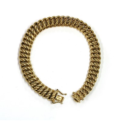 Lot 205 - A 9ct gold hollow double curb link bracelet, by UnoAErre