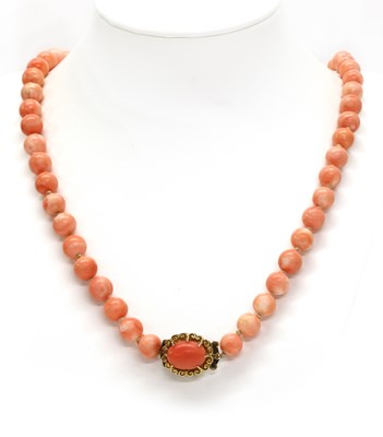 Lot 59 - A single row uniform coral bead necklace
