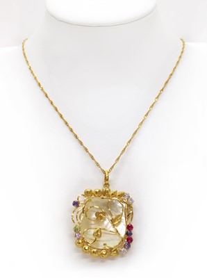 Lot 232 - A gold mother-of-pearl and cubic zirconia set pendant