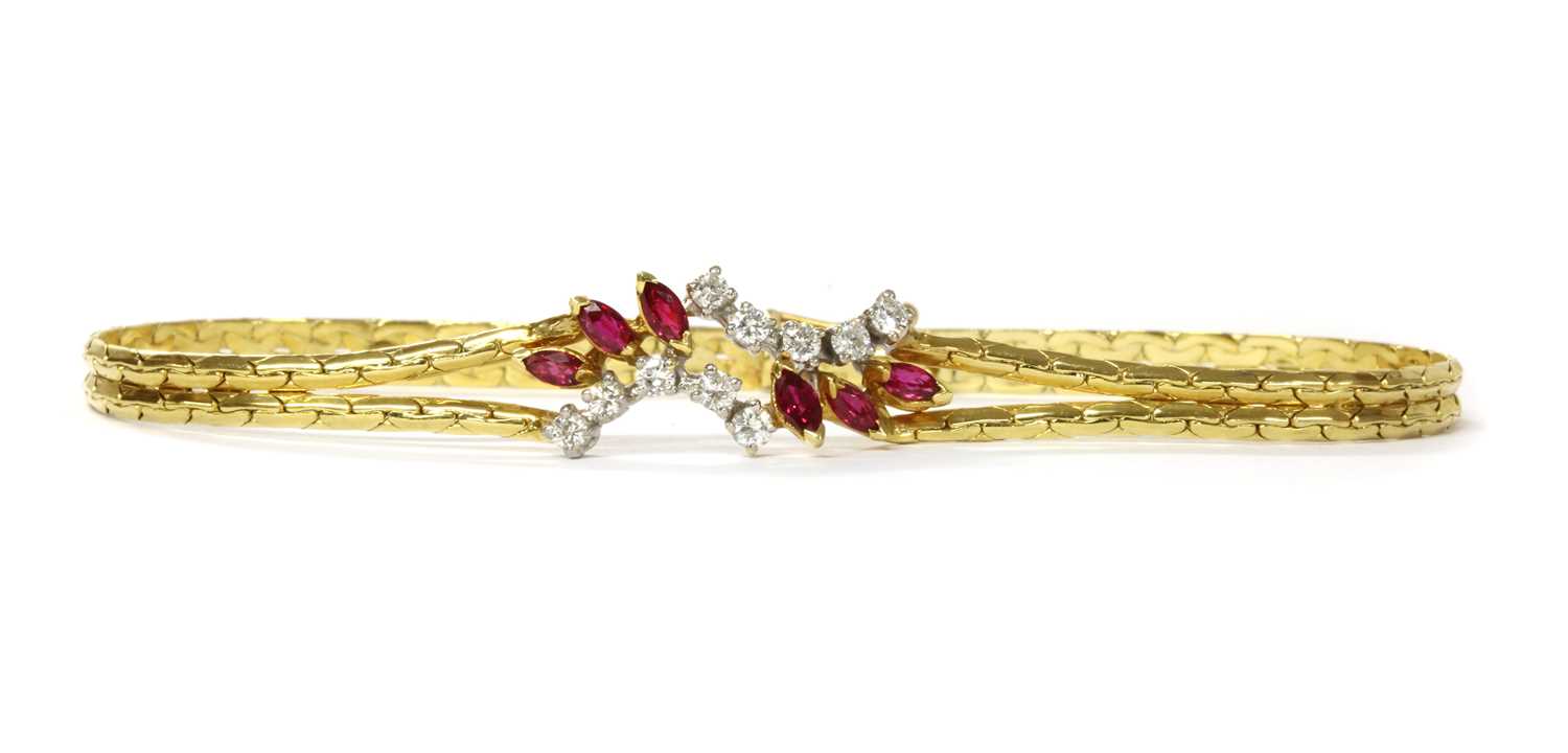 Lot 1147 - An 18ct gold ruby and diamond bracelet