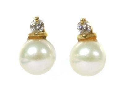 Lot 1257 - A pair of gold cultured pearl and diamond earrings
