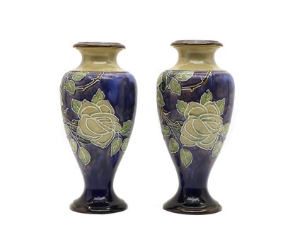 Lot 81 - A pair of Royal Doulton stoneware Roses pattern vases