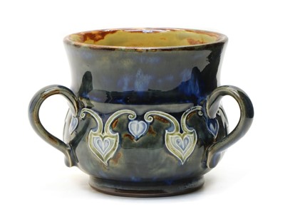 Lot 252 - A Doulton Lambeth stoneware loving cup