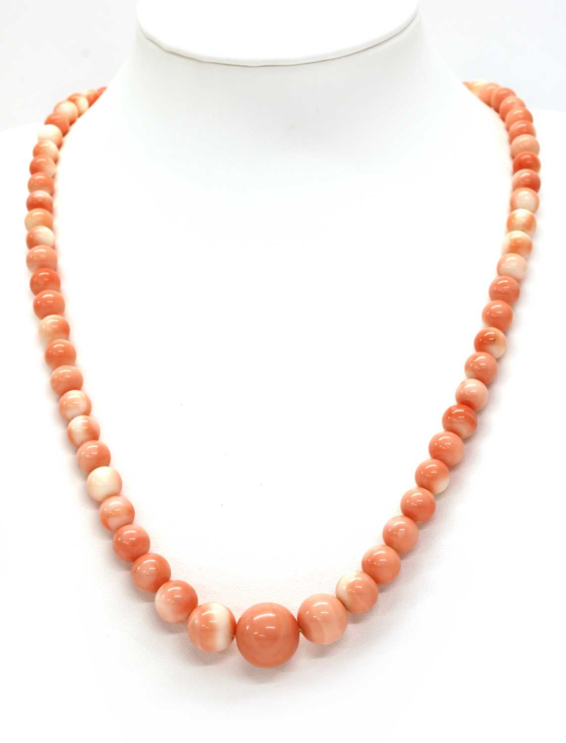 Lot 60 - A single row graduated coral bead necklace