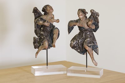 Lot 618 - A pair of carved limewood and polychrome painted wooden figures of angels