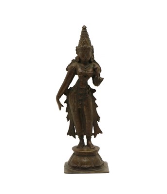 Lot 98 - A Tibetan bronze of a dancer on lotus leaf base