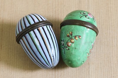 Lot 730 - Two George III enamel egg-shaped nutmeg graters